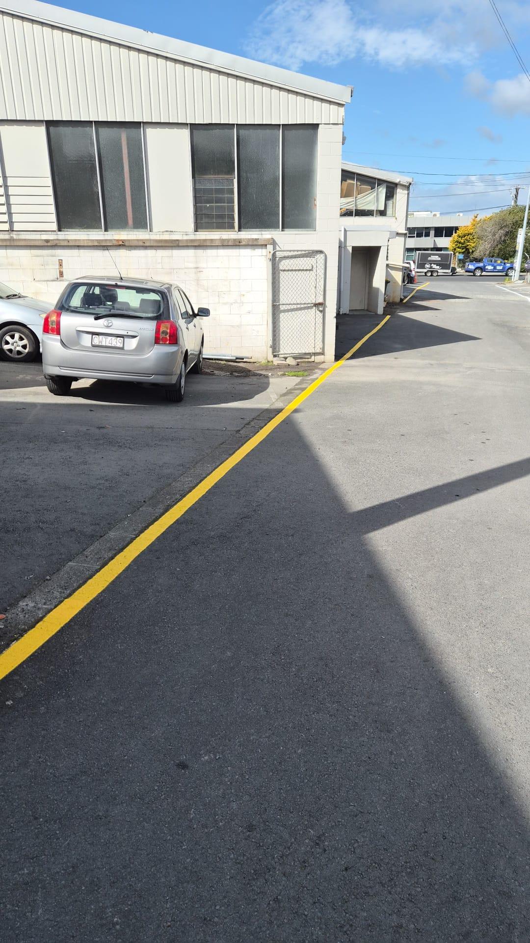 Freshly painted car park bays with crisp white lines